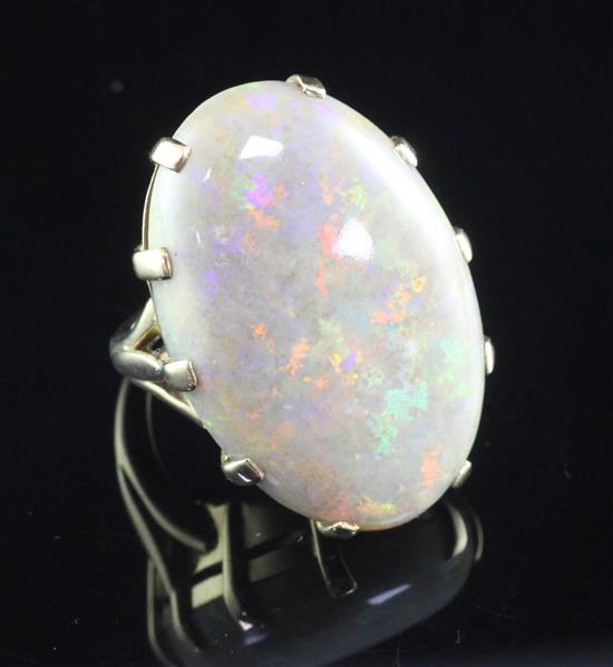 A large 9ct gold and opal dress ring, size O.